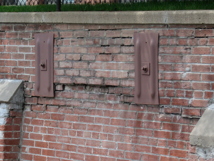 repair leaning brick wall